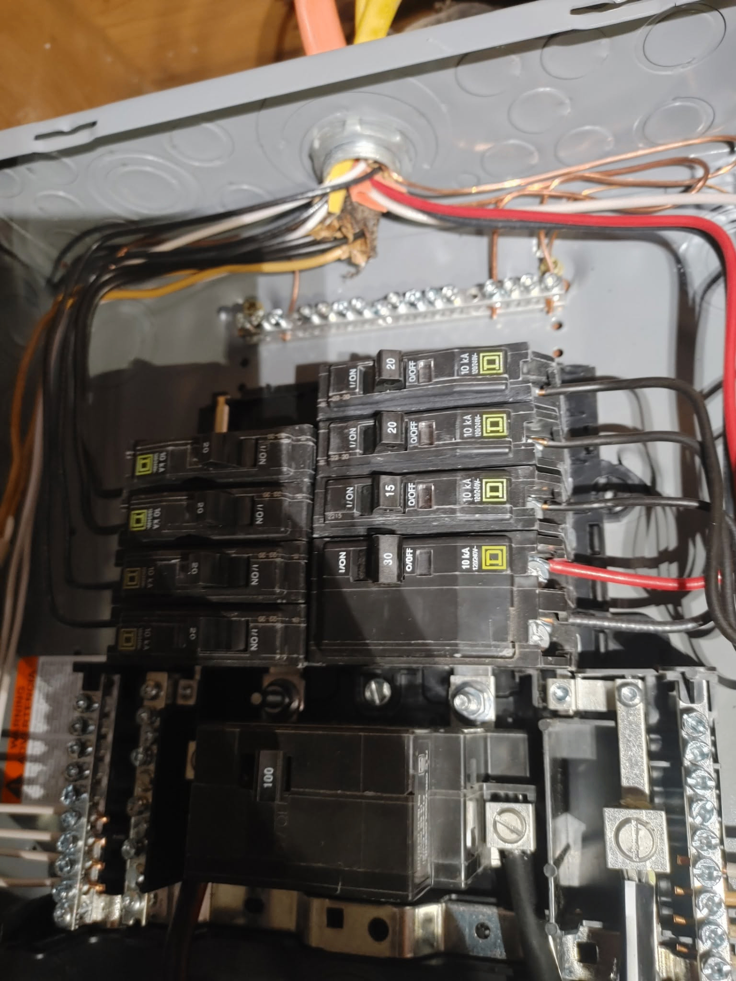 Licensed electrician working on a panel
